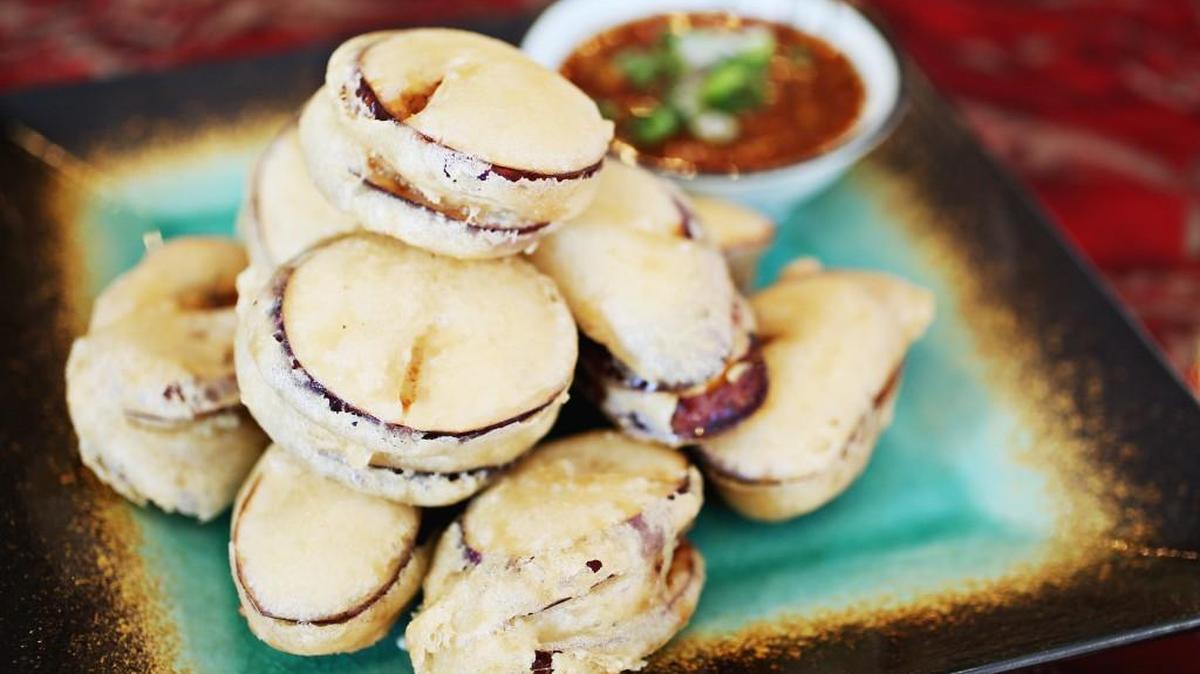 The Fried Eggplant Boxes served as an entree adapts beautifully as a shared starter: chunks of eggplant stuffed with minced pork and chives, then fried in a tempura-like batter and served with a spicy dipping sauce on the side at Szechuan Garden in Morrisville.