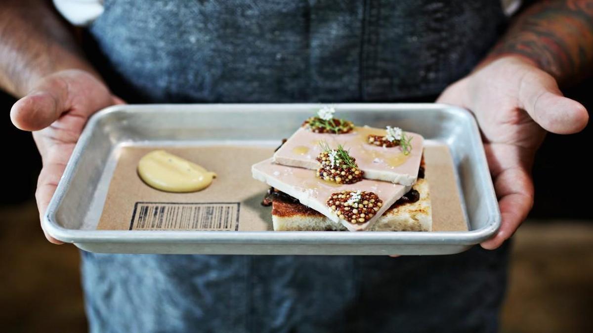 Chef Eric Montagne of Standard Foods in Raleigh holds the Rabbit Liver Paté – rich and smooth as butter, served over a crisp slab of toasted milk bread and garnished with pungent dollops of whole grain mustard.