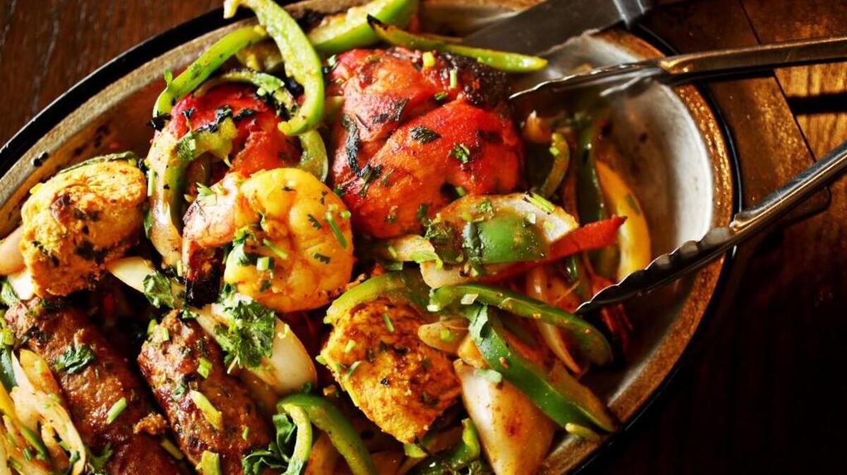 The Mixed Platter is a Tandoori Specialty made up of chicken tandoori, lamb kebab, shrimp tandoori and chicken malai tikka at Zeera Indian Restaurant in Fuquay-Varina.