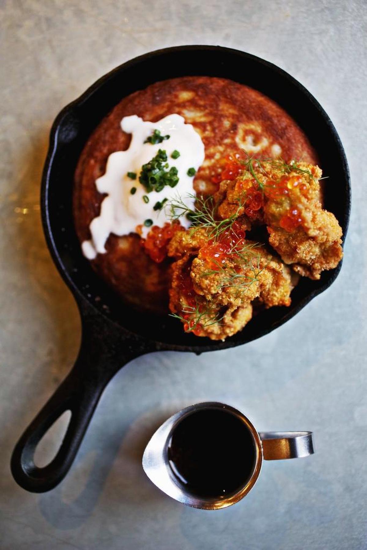 The Fried Oysters and Oat Hotcake is made up of half a dozen cornmeal-crusted oysters with an oat hotcake drizzled with chile-spiked cane syrup. Served in a miniature cast iron skillet, the Cajun-accented shellfish riff on chicken and waffles proved so popular that it earned a spot on the regular menu.