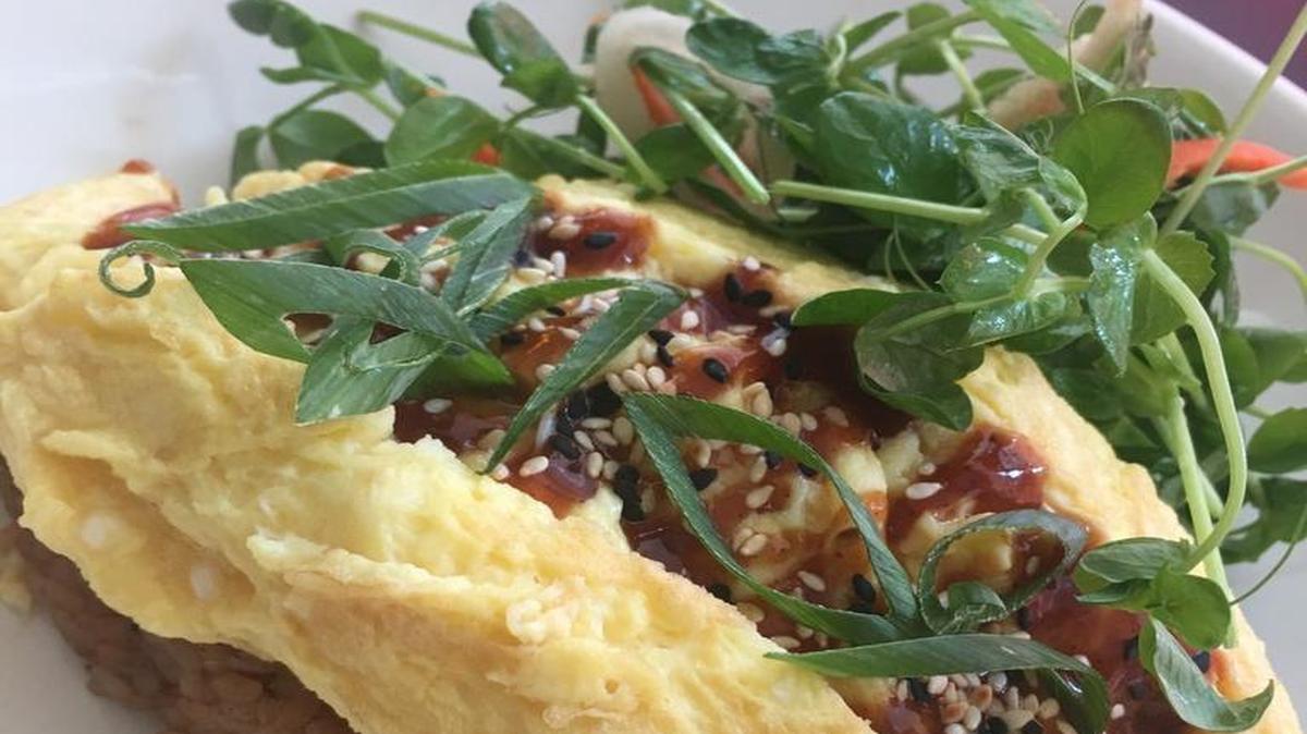 Omurice, a Japanese-style omelet over fried rice, is one of the new brunch dishes at Garland.