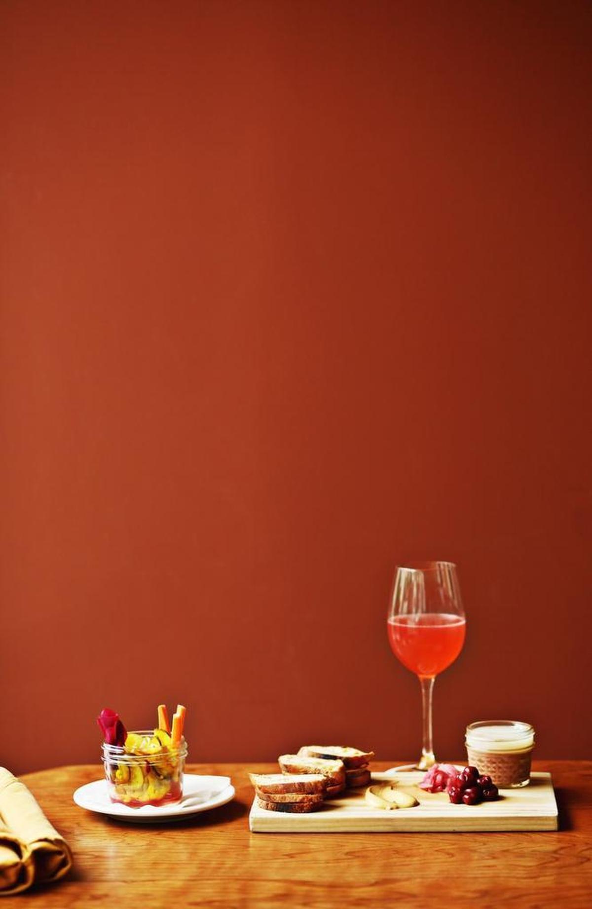 The Afloat cocktail made up of cava, housemade blackberry syrup, lemon and a hint of bourbon pairs well with the Chicken Liver and Foie Gras Mousseline and the Jar of Pickles.