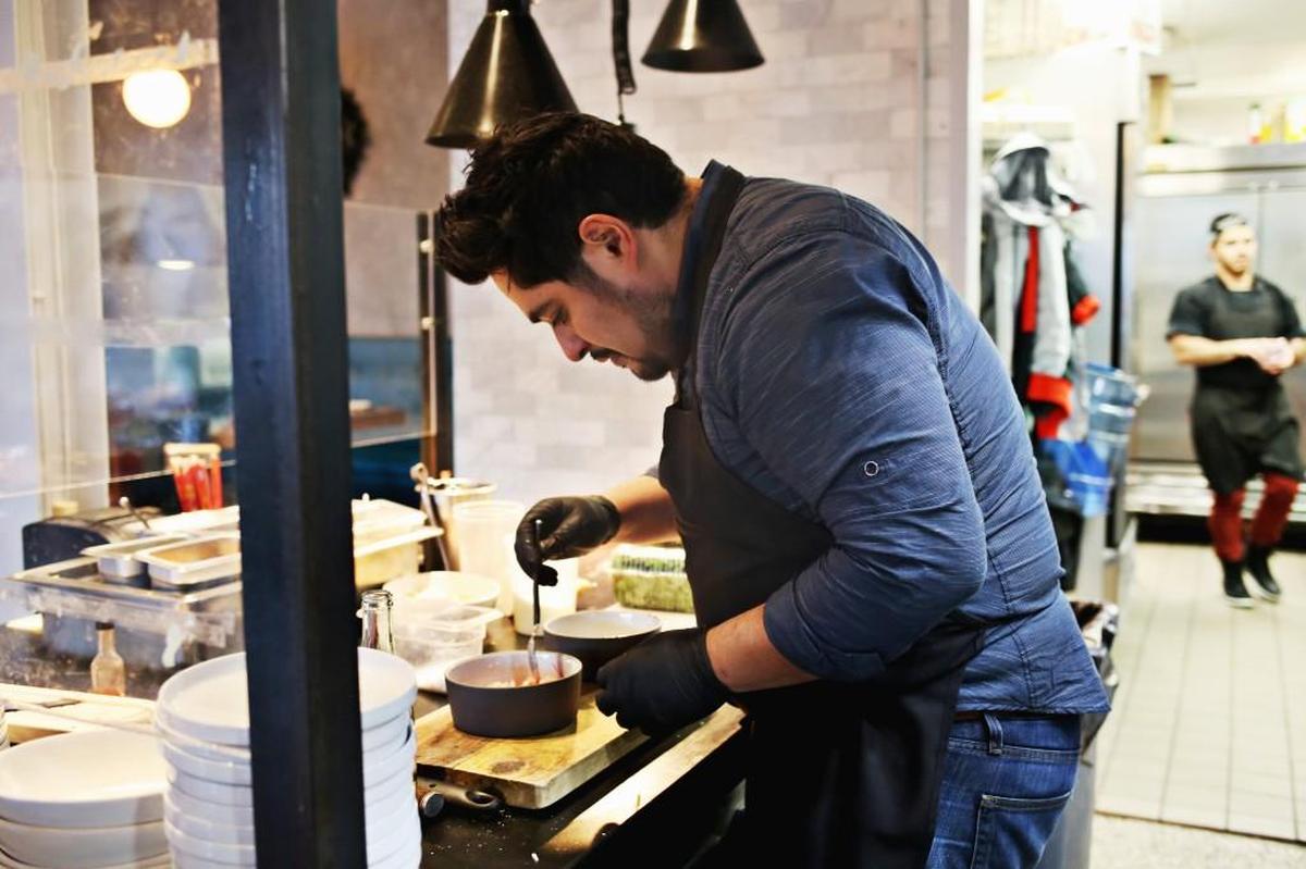 Chef Oscar Diaz prepares the Tiger Ceviche made up of bigeye tuna in a citrusy, moderately spicy Peruvian leche de tigre marinade, garnished with sea asparagus and sliced radishes, with crunchy tostadas on the side at The Cortez on Wednesday, Dec. 13, 2017.