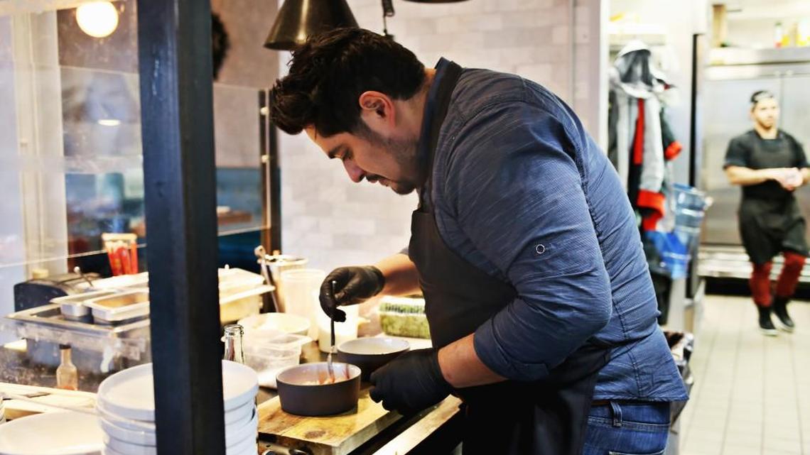 Chef Oscar Diaz prepares the Tiger Ceviche made up of bigeye tuna in a citrusy, moderately spicy Peruvian leche de tigre marinade, garnished with sea asparagus and sliced radishes, with crunchy tostadas on the side at The Cortez on Wednesday, Dec. 13, 2017.