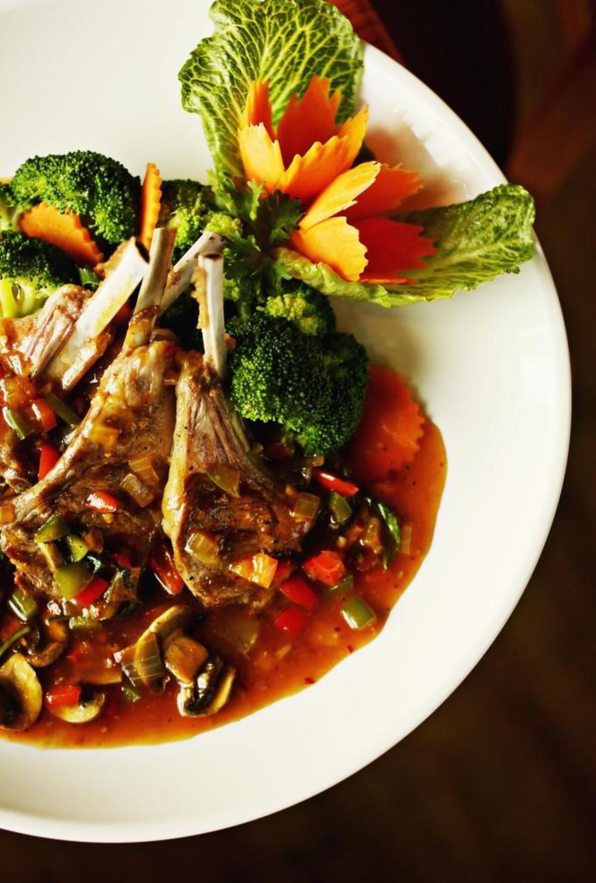 One of the chef’s specialties at Thai Lotus: Ka Prod Lamb, which serves up four grilled chops in a spicy basil sauce.