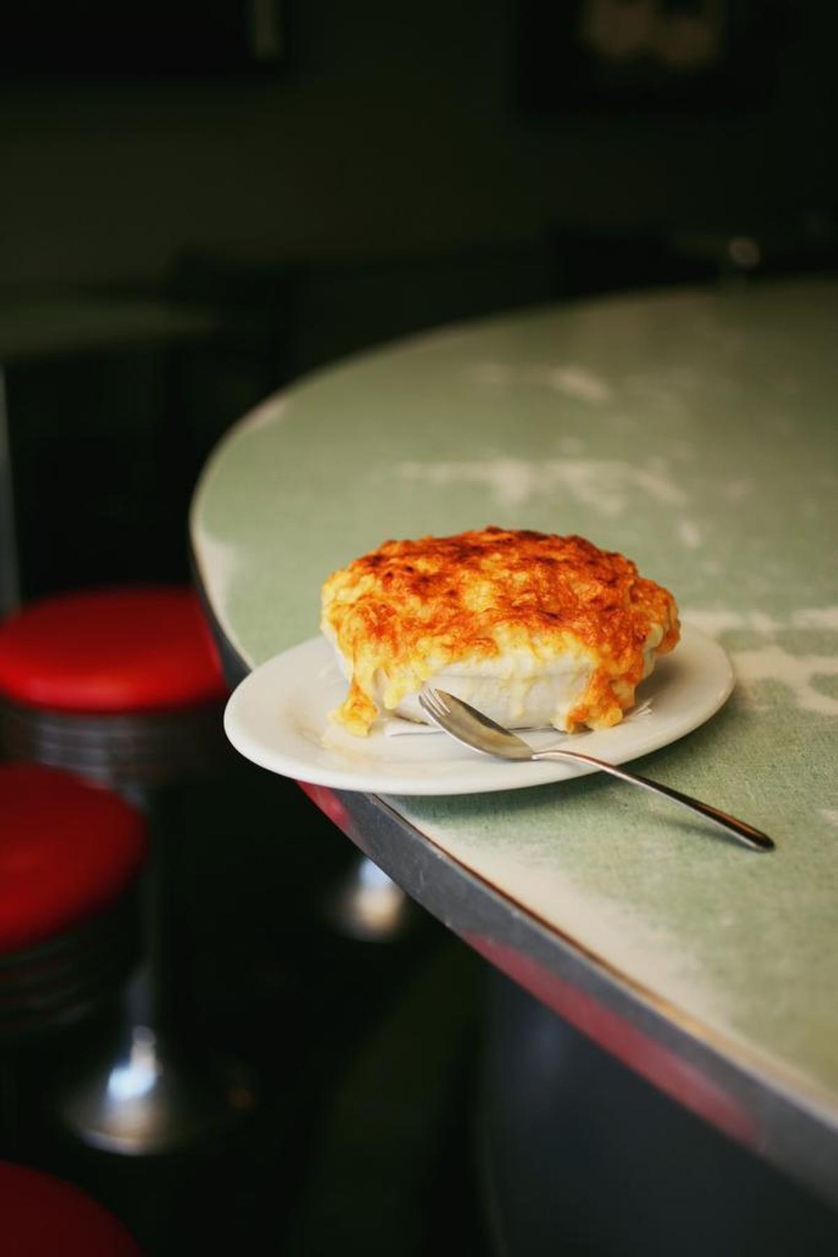 Eater’s restaurant critic Bill Addison cites the macaroni and cheese at Poole’s Diner in his 2017 list of America’s Essential Restaurants. “The menu is always changing with the seasons, but the maraconi au gratin is forever,” he writes.