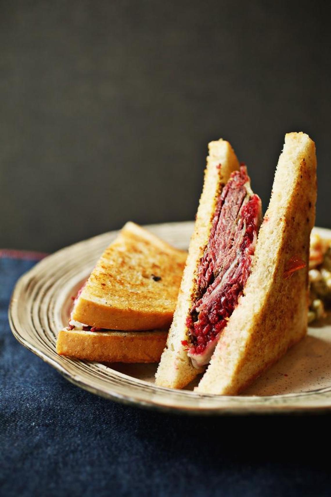 Maybelle's Pastrami has a house-made brined and smoked brisket pastrami served with a a sweet & sour beet relish, havarti cheese and brown mustard on grilled sourdough at GRUB in Durham.
