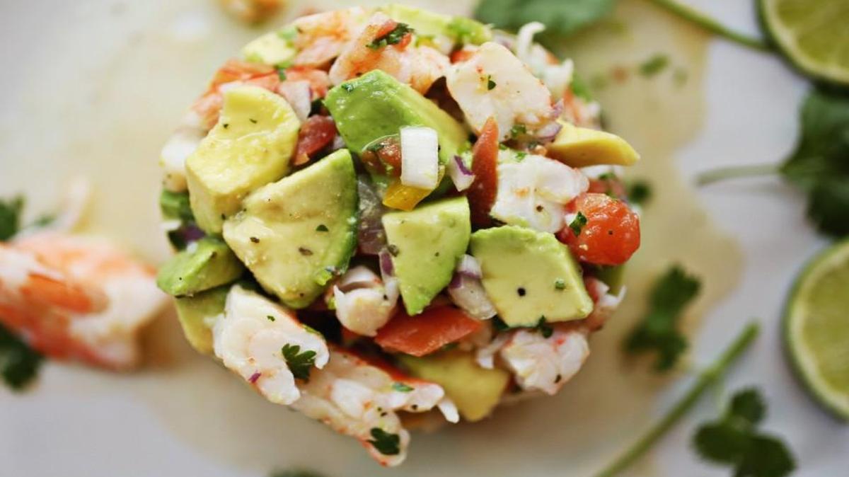 Ceviche de pescado, a bright patchwork of diced tilapia, tomato, avocado, onion and jalapeño in a marinade of lemon and lime, is attractively presented as a molded cylinder. Served with crispy corn tostadas, it works equally well as a shareable starter or light entree.