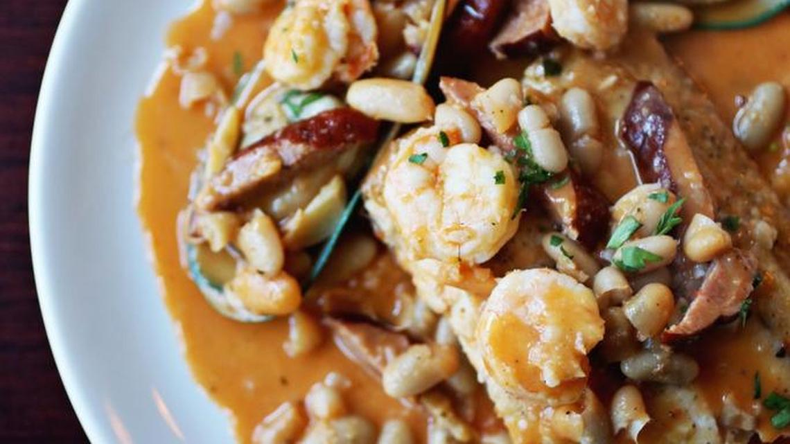 Bruno's Italian Bistro serves a mahi "Tuscan" with shrimp, cannellini beans and andouille sausage in a light tomato-tinged broth.