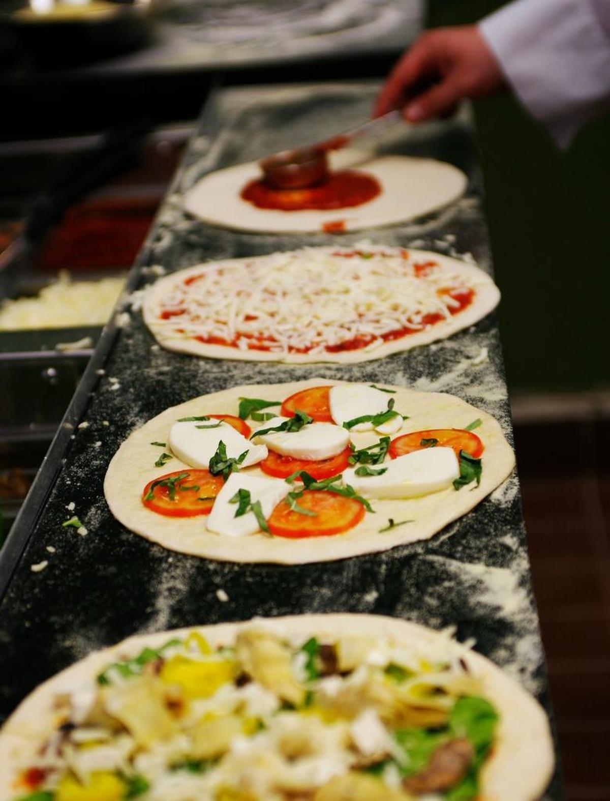 Your Pie is opening its fast-pizza restaurants in Cary and Raleigh’s Brier Creek. The pizza dough is hand-tossed. The pizzas come with unlimited toppings. Diners can choose which ones they want as they walk down the counter line.