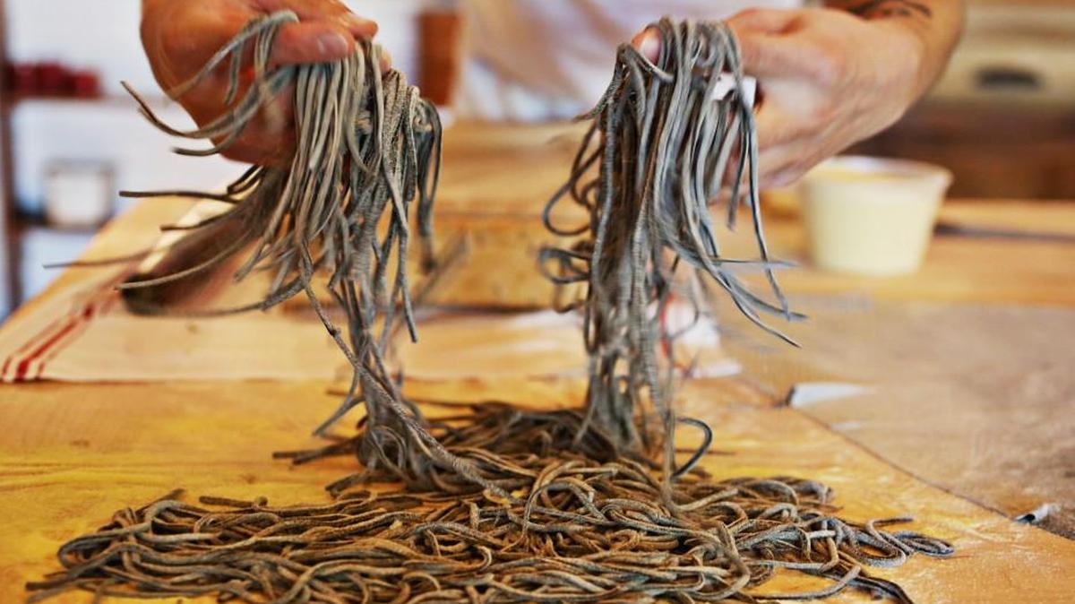 Mothers & Sons owner and chef Josh DeCarolis makes homemade tonnarelli at the Durham restaurant on Wednesday, Oct. 20, 2016. DeCarolis spent four months late last year in Italy mastering the technique for the handmade pastas that would become a signature feature of the Mothers & Sons menu.