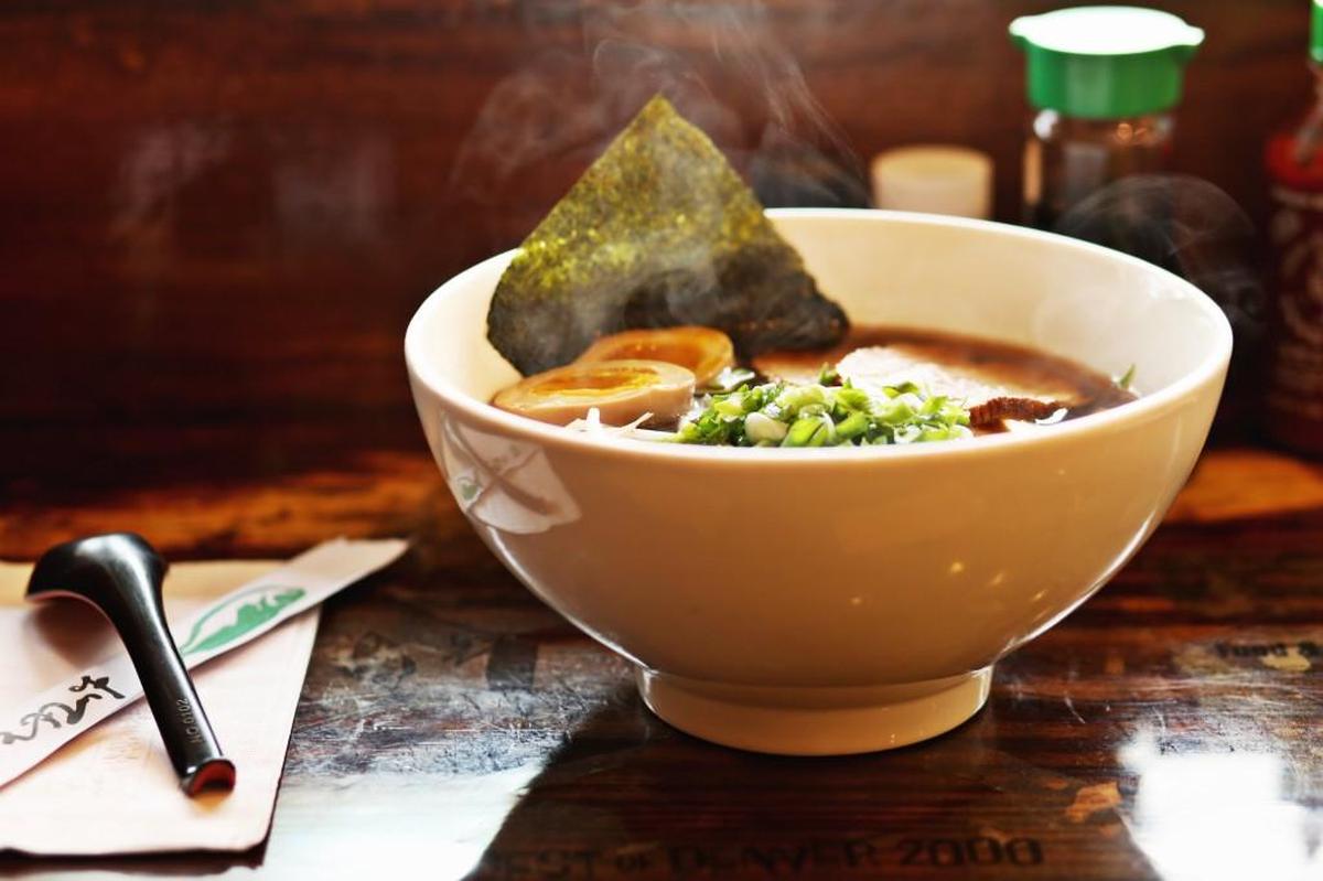 Steam rises off a bowl of Shoyu Ramen with braised pork belly, bok choy and a soy-marinated ajisu egg in a fragrant umami-rich broth at Noodle Boulevard in Cary.