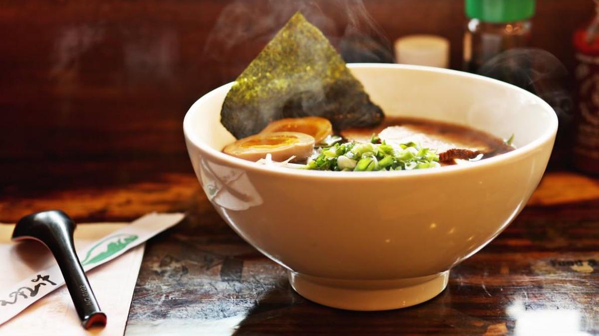 Steam rises off a bowl of Shoyu Ramen with braised pork belly, bok choy and a soy-marinated ajisu egg in a fragrant umami-rich broth at Noodle Boulevard in Cary.