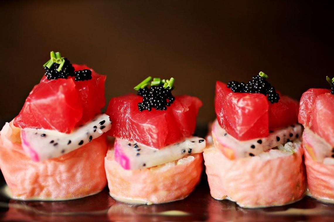The Dragon Tuna is one of several specialty rolls at City Market Sushi in Raleigh made up of panko softshell crab and avocado wrapped in soy paper with dragon fruit, tuna, tobiko and wasabi yuzu on the outside.