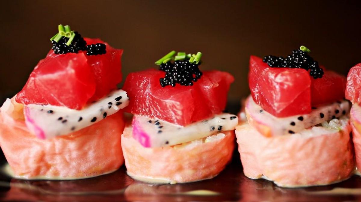 The Dragon Tuna is one of several specialty rolls at City Market Sushi in Raleigh made up of panko softshell crab and avocado wrapped in soy paper with dragon fruit, tuna, tobiko and sweet ponzu on the outside.