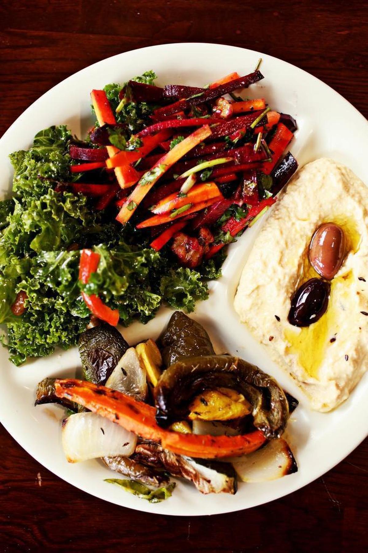 The four-item sampler at Sassool is made up of a choice of salads, dips and hot items.