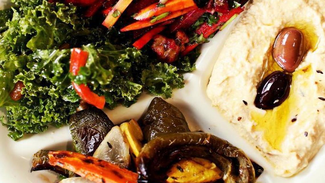 The four-item sampler at Sassool is made up of a choice of salads, dips and hot items.