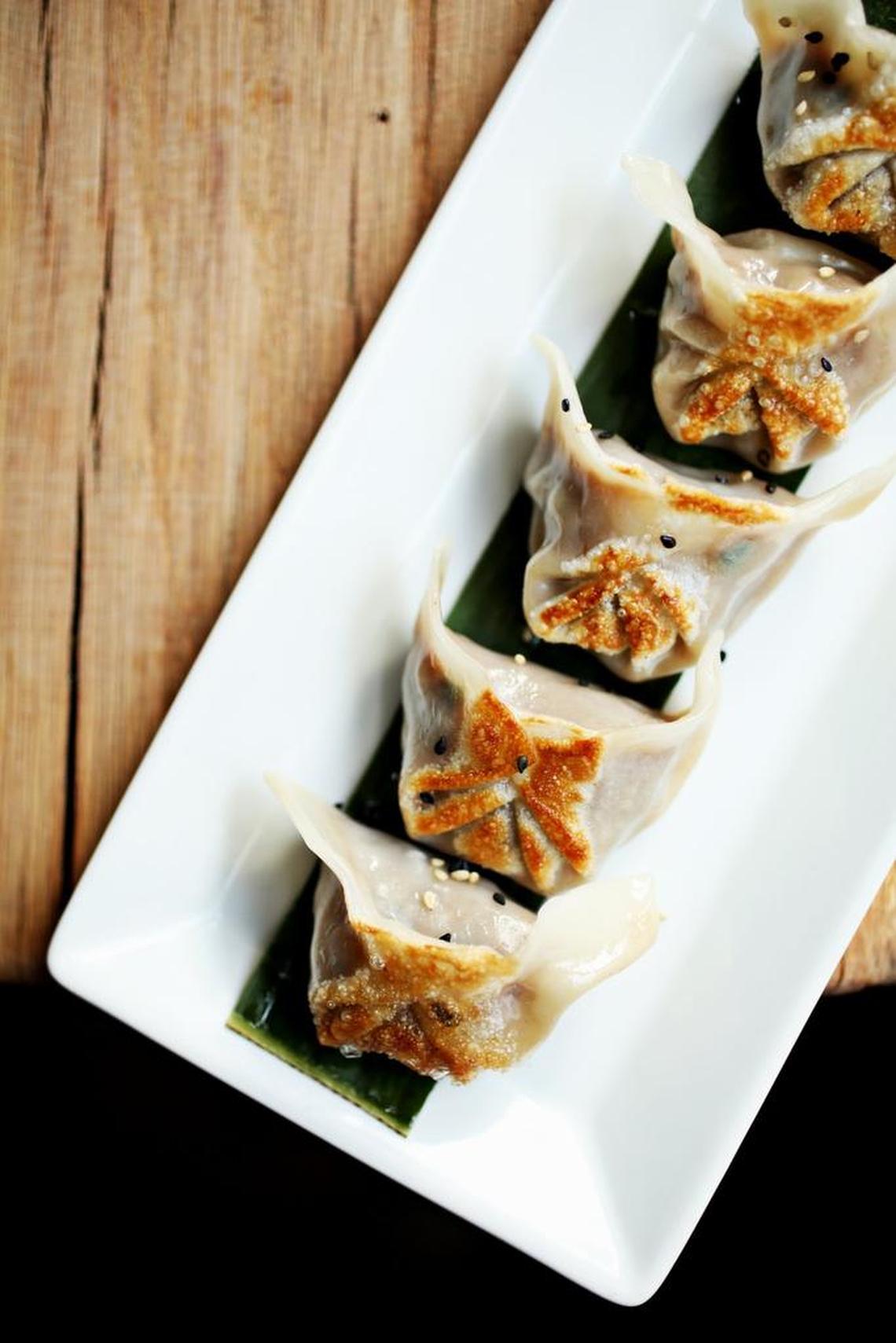 Pork & Chive Dumplings are served with sweet & spicy and black vinegar toasted sesame sauces at Mofu Shoppe in downtown Raleigh.
