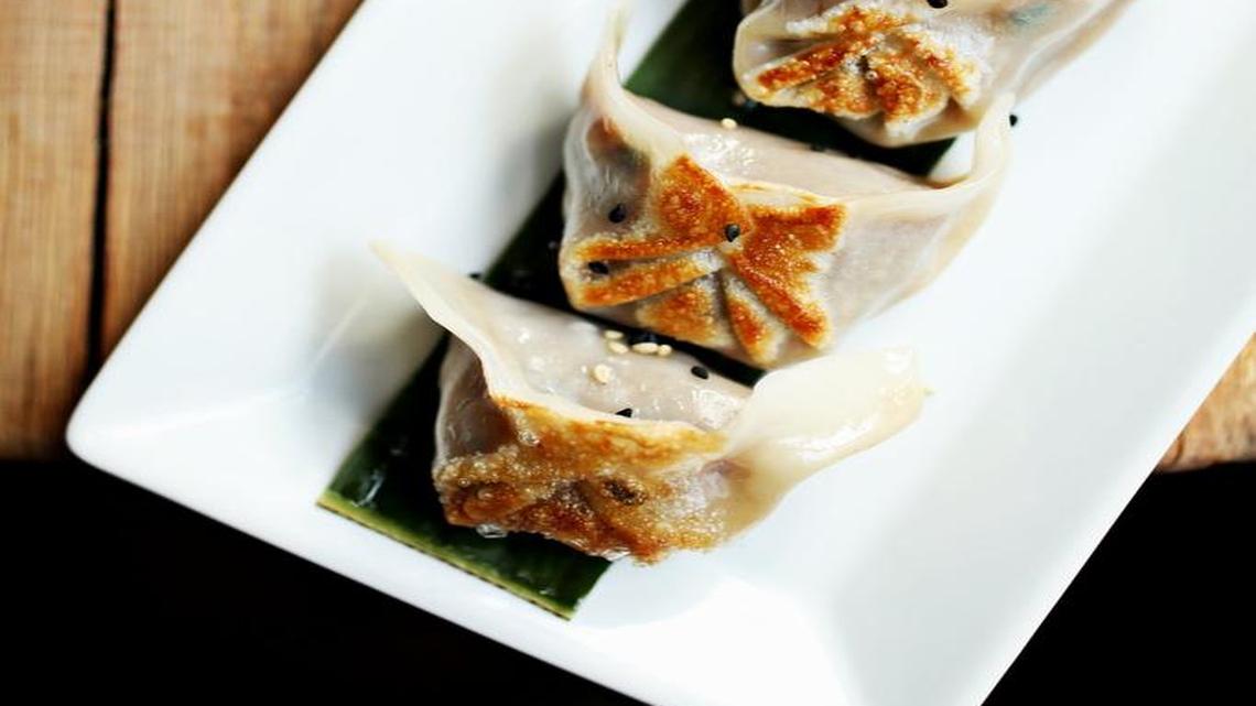 Pork & Chive Dumplings are served with sweet & spicy and black vinegar toasted sesame sauces at Mofu Shoppe in downtown Raleigh.