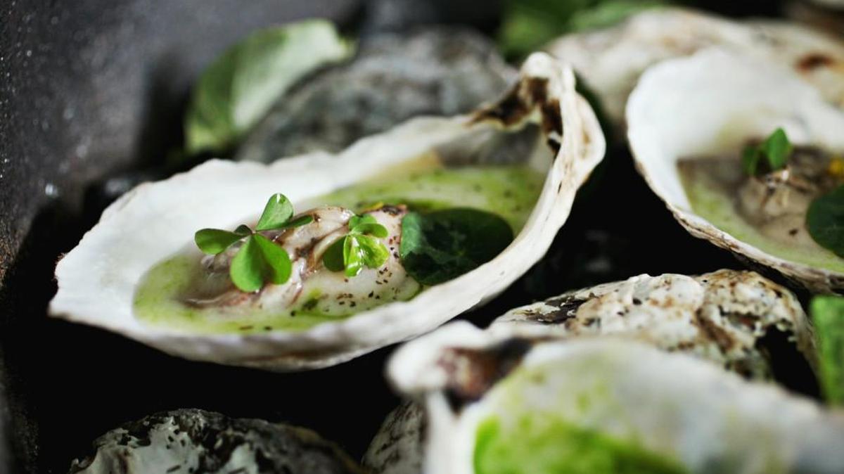 Embered oysters were on the menu at Provenance, in downtown Raleigh. The restaurant closed Oct. 2, 2017.