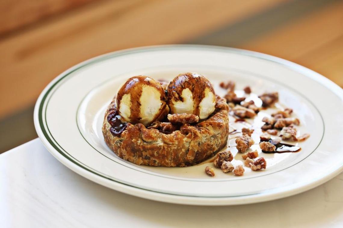 You might find it impossible to resist the siren call of Phoebe Lawless’ Double Crust Muscadine Pie, which she’s serving with a couple of scoops of crème fraîche ice cream on a plate scattered with candied pecans, at The Lakewood in Durham.