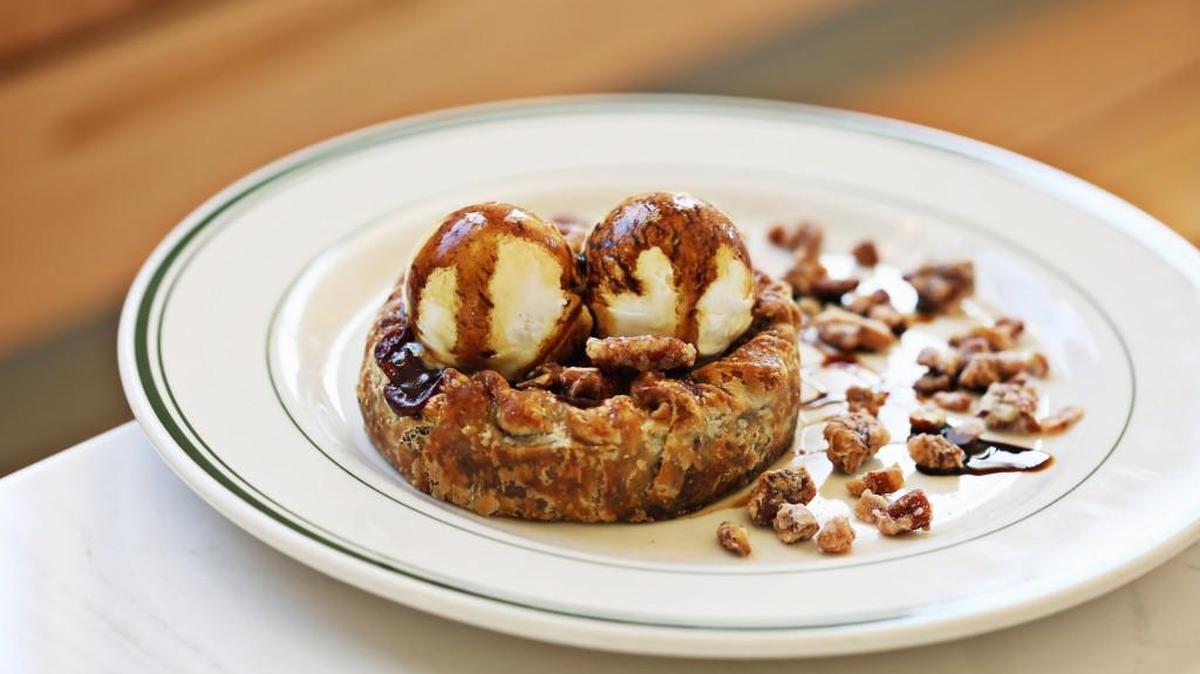 You might find it impossible to resist the siren call of Phoebe Lawless' Double Crust Muscadine Pie, which she’s serving with a couple of scoops of crème fraîche ice cream on a plate scattered with candied pecans, at The Lakewood in Durham.