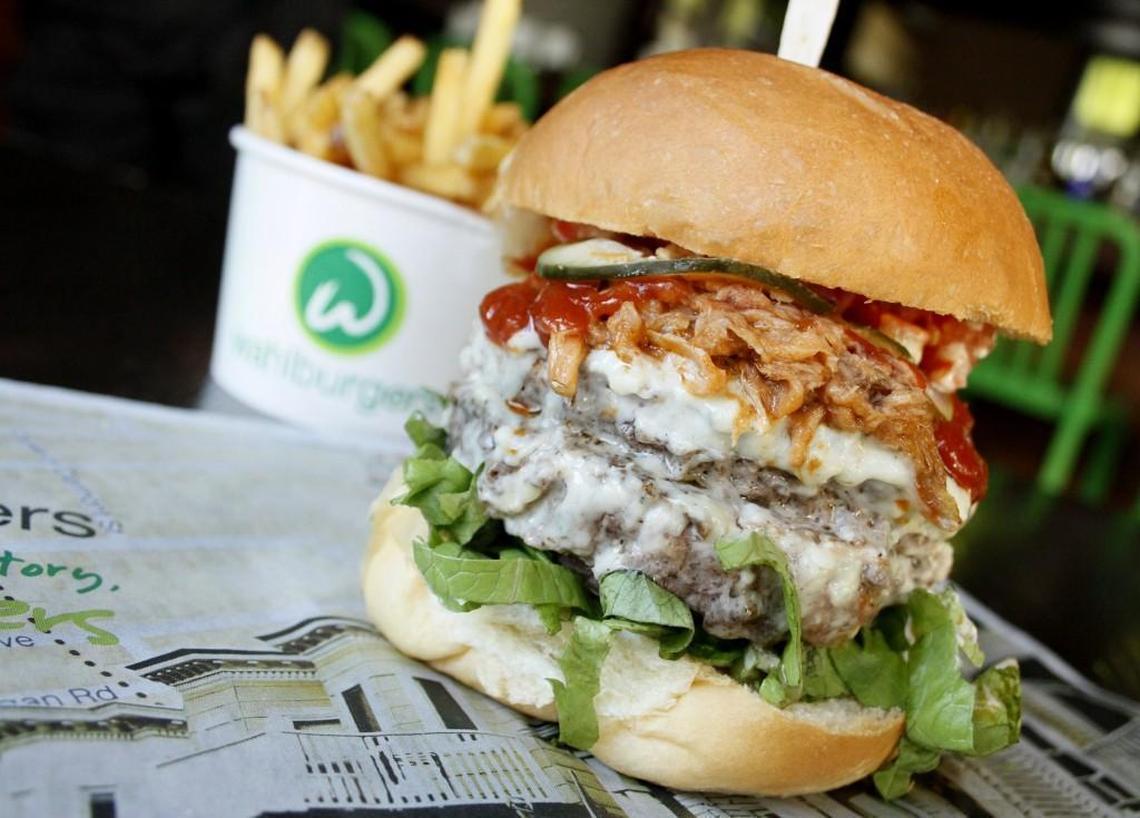 Wahlburgers’ The Beast Burger is two 5-ounce burgers, lettuce, tomato, pulled pork, housemade blue cheese sauce, pickles and BBQ sauce. It is $11.95.