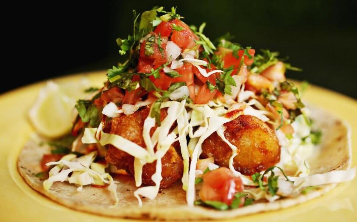 The Negra Modelo Pescado Frito at Virgil’s Original Taqueria in Raleigh is made up of atlantic cod, poblano tarter, cabbage, pico, salsa roja, onion and cilantro.