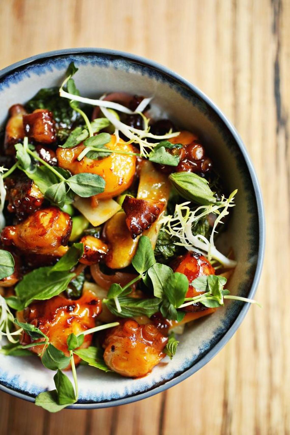 The Sweet and Sour Octopus Bowl is made up of cabbage edamame slaw, pickled radish, roasted pepper, crispy broad beans and coconut rice at Mofu Shoppe in downtown Raleigh.