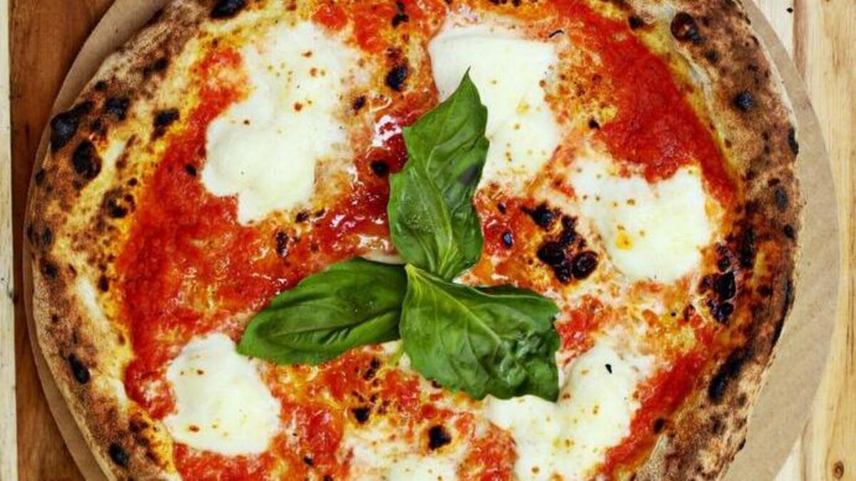 A perfect margherita pizza, its blistery, leopard-spotted crusted topped with just the right amount of crushed tomatoes, fresh mozzarella and basil. The Margherita on the Napoli food truck is one of Greg Cox’s favorites.