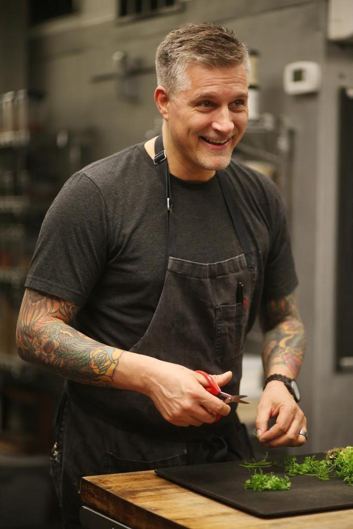 Chef Scott Crawford laughs with staff in the kitchen while prepping for service Thursday afternoon, Jan. 18, 2018, at Crawford and Son. The downtown Raleigh restaurant has been chosen as this year's Restaurant of the Year.