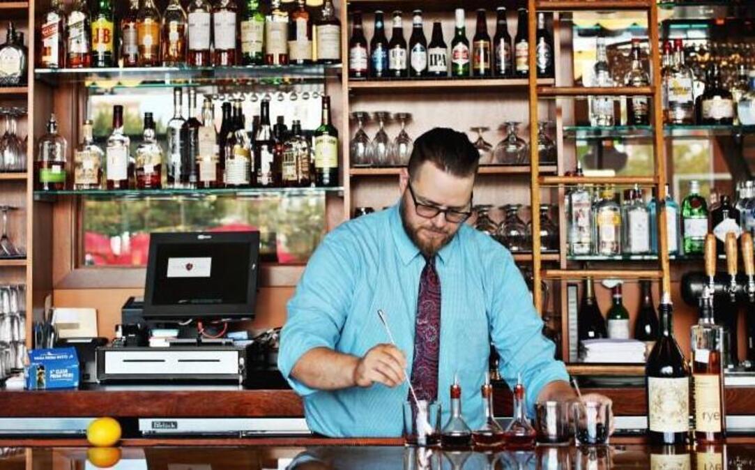 Bar manager and managing partner Brad Weddington of NanaSteak in Durham makes an Old Fashioned at the restaurant's bar.