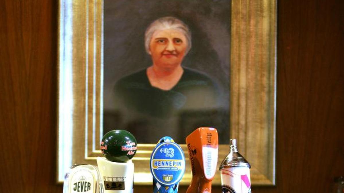 A painting and photographs of the Hatem and Saleh family's grandmothers in the Old World hang on the walls of the Lebanese restaurant, Sitti.