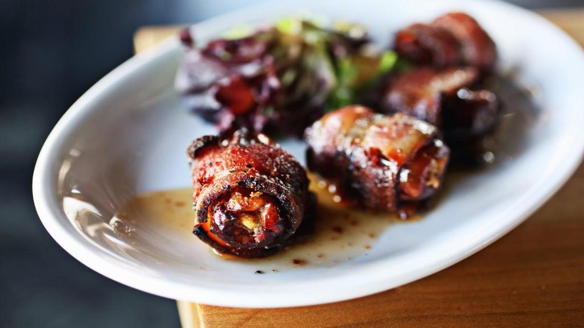 Bacon-wrapped dates stuffed with goat cheese at Raleigh’s Parkside.