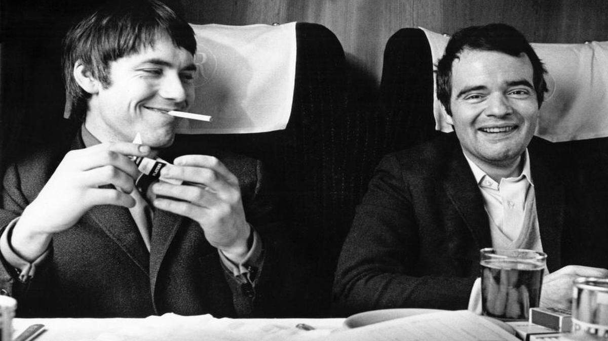 
Chris Stamp, left, and Kit Lambert, The Who’s managers, take the train to Manchester in 1966. They met while working at a London film studio. 
