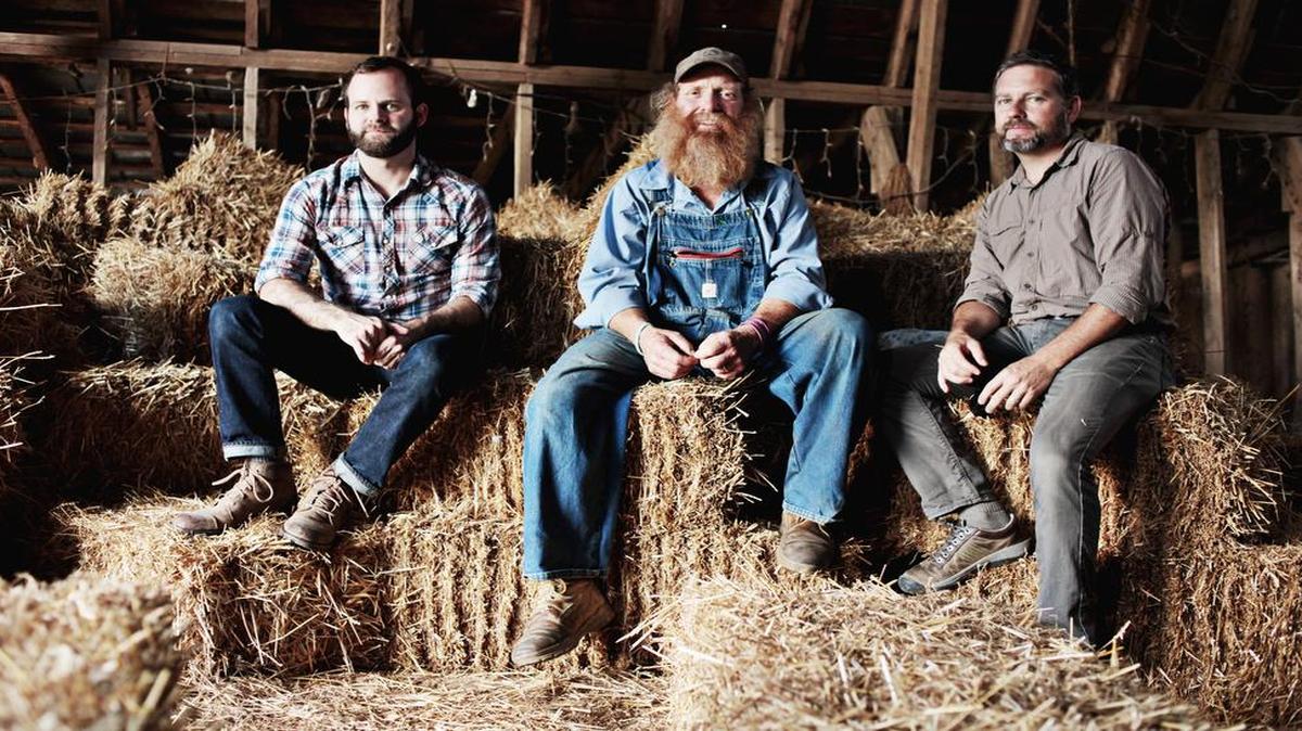 
From left, Jason Arthurs, Randy Lewis and Ted Richardson on Monday, May 11, 2015, in the barn at Lewis' Snow Camp dairy farm. Richardson and Arthurs just completed a documentary on the fifth-generation dairy farmer.

