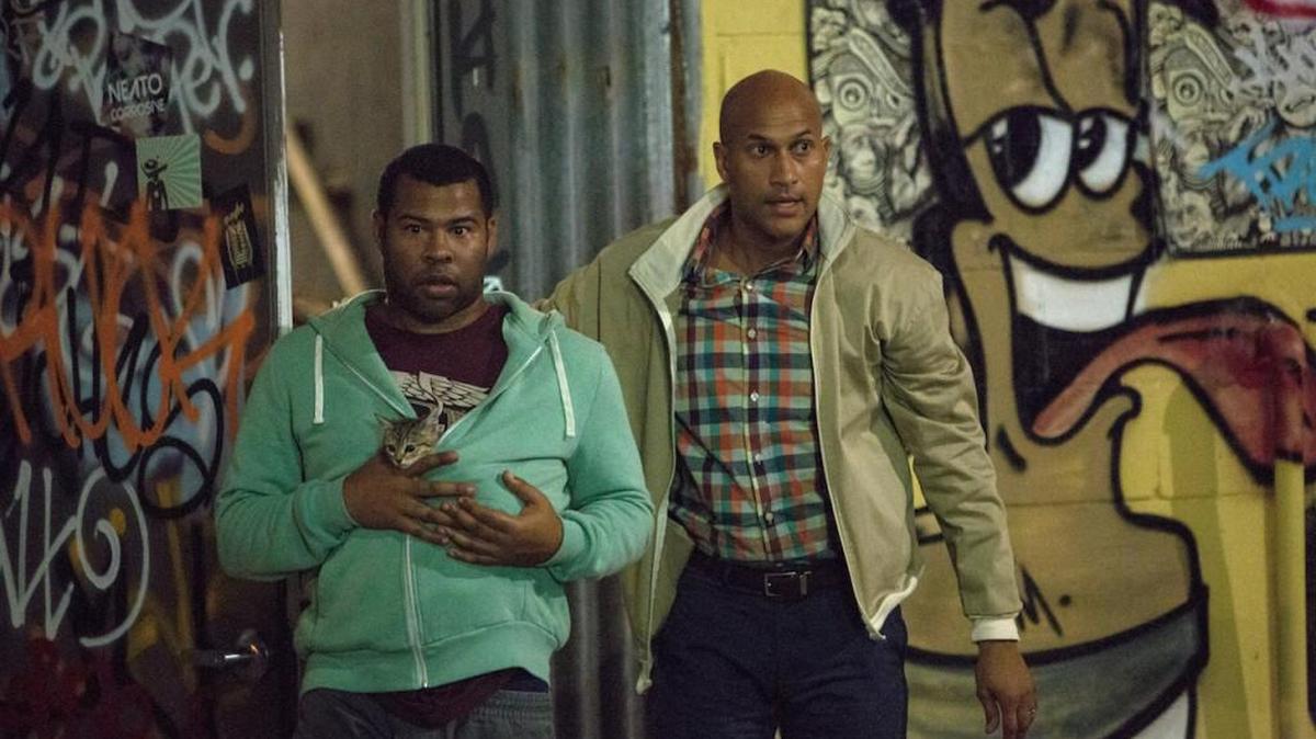 Jordan Peele (left, holding Keanu the kitten) and Keegan-Michael Key in the action comedy caper “Keanu.”