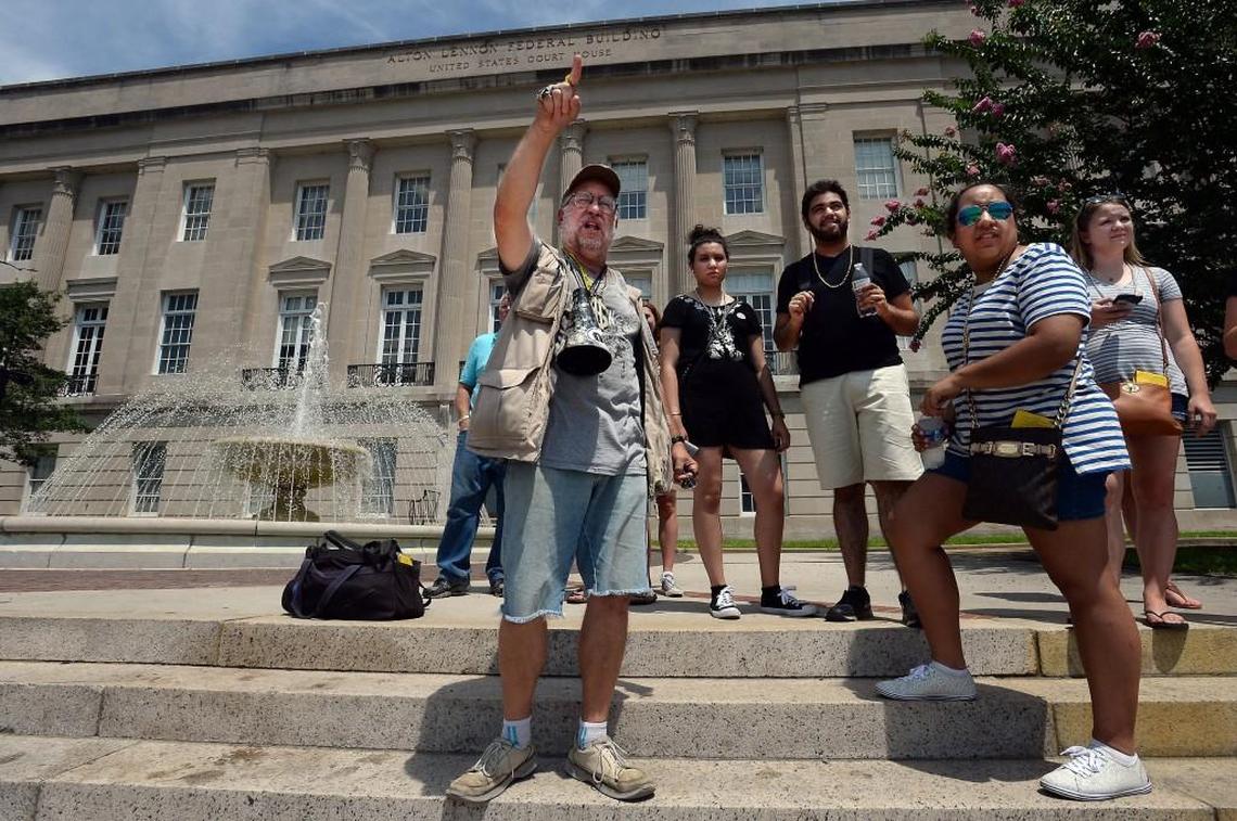 Mike Hartle, who calls himself Spiel Stevenberg. gestures to the Cape Fear River while on the steps of the Alton Lennon Federal Building in Wilmington, N.C. July 26, 2016. He was leading a group of film buffs on the Hollywood Location Walk, pointing out various areas where movies and television shows have been filmed in the riverside town.