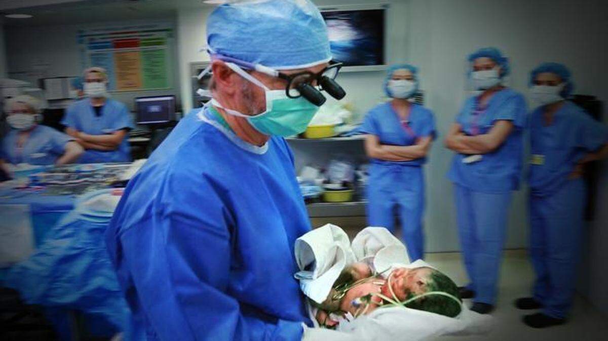 
Dr. Alan Flake with Lilly, moments after her birth at The Children’s Hospital of Philadelphia’s Special Delivery Unit, in a scene from “Twice Born.” The PBS documentary looks at the Special Delivery Unit, where rare surgeries are performed on babies inside the womb.


