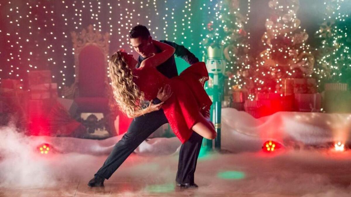 Alexa PenaVega and Carlos PenaVega in the Hallmark movie “Enchanted Christmas.”