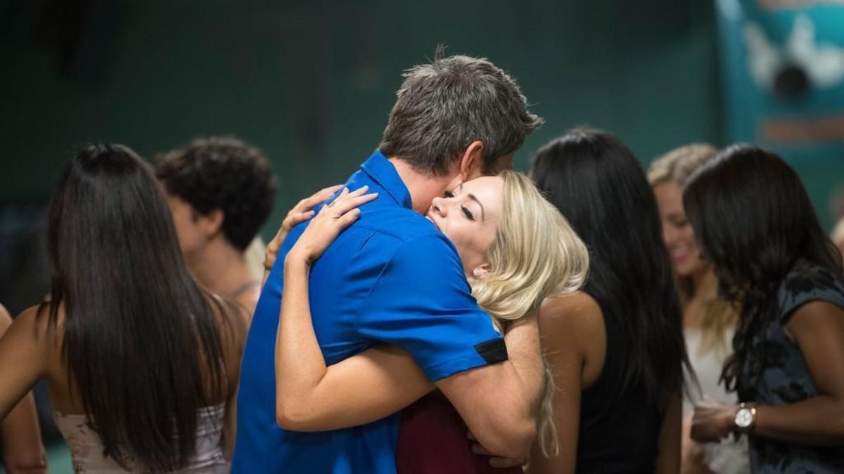Jenna Cooper hugs Arie Luyendyk Jr. during a bowling match on the Jan. 29 episode of “The Bachelor” on ABC.