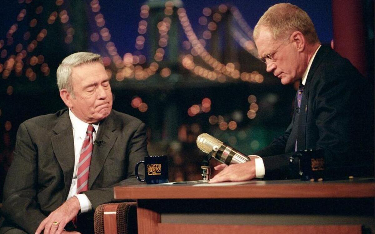 
Dan Rather, of the CBS Evening News, is comforted by David Letterman during a break after Rather was overcome by emotion while discussing the tragedies of 9/11 on “The Late Show with David Letterman,” September 17, 2001. 
