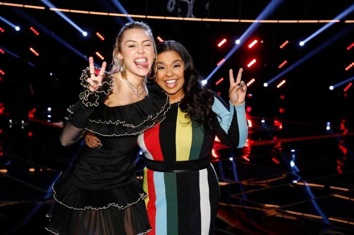 Coach Miley Cyrus, left, with Brooke Simpson after Simpson was named as a finalist on “The Voice.”