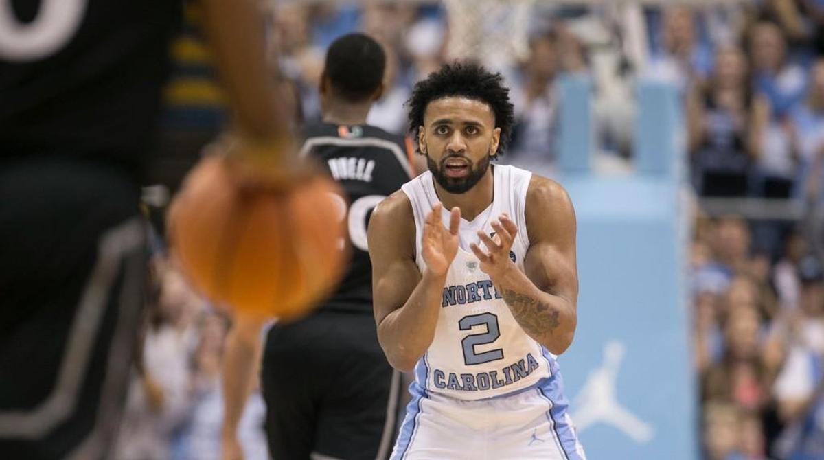 North Carolina/s Joel Berry II applauds his teammates after a basket in a game against Miami on Feb. 27 at the Smith Center in Chapel Hill.