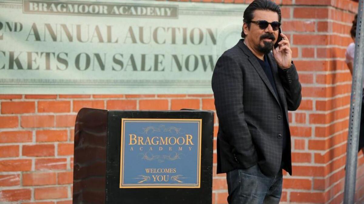 In the opening episode of “Lopez,” George waits outside Bragmoor Academy before being auctioned off.