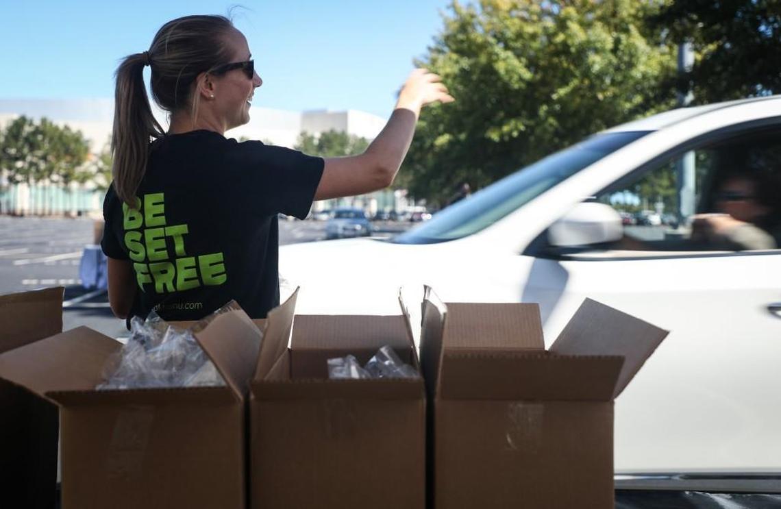 Anne Badalamenti, an employee of Mohu, passes out free antennas to AT&T U-verse customers outside PNC Arena on Monday Oct. 2. The antennas will allowed customers to access WRAL and WRAZ channels for free during the contract dispute between AT&T U-verse and Capital Broadcasting Co.