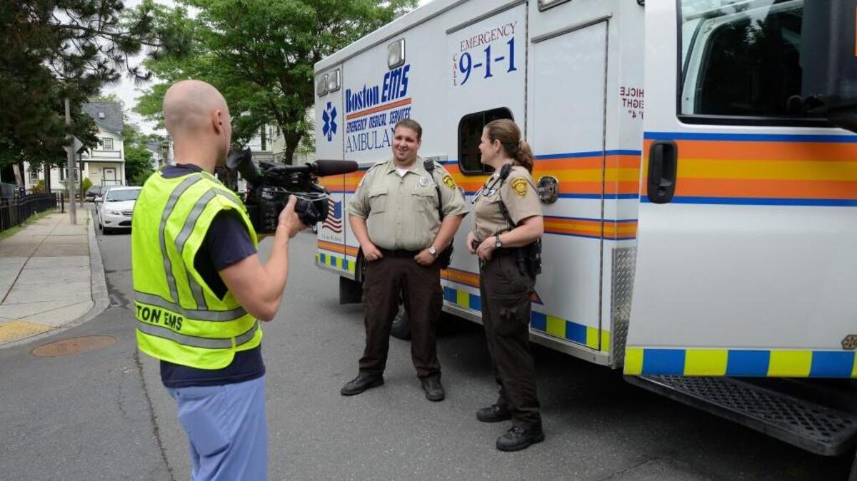 Camera crews follow Boston EMS units as they bring patients and loved ones into the hospitals.