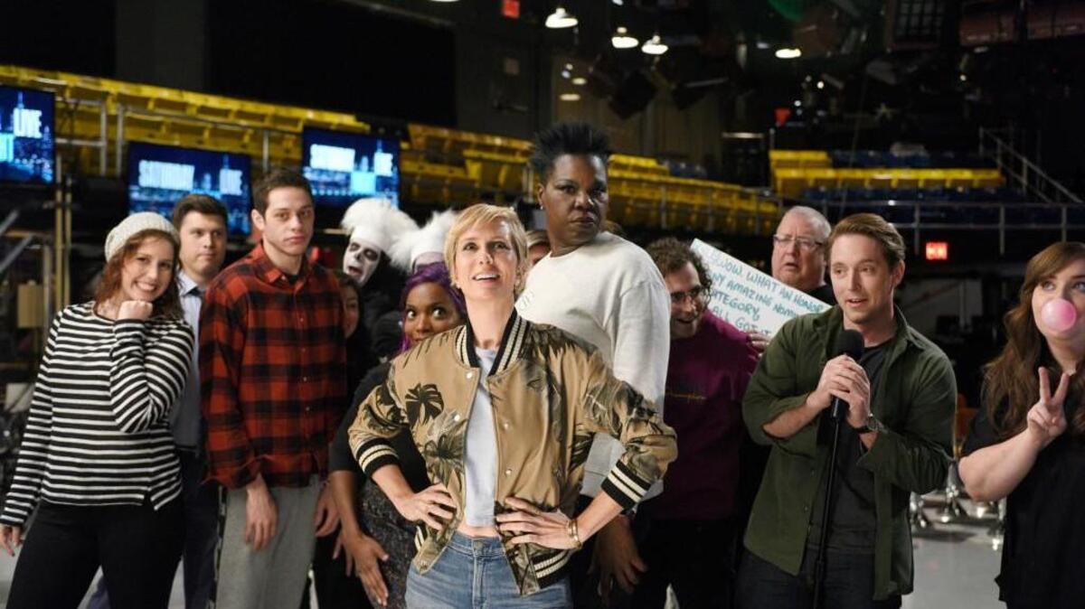 (L-R): Vanessa Bayer, Colin Jost, Pete Davidson, Sasheer Zamata, host Kristen Wiig, Leslie Jones, Kyle Mooney, Wally Feresten, Beck Bennett and Aidy Bryant on “Saturday Night Live.”