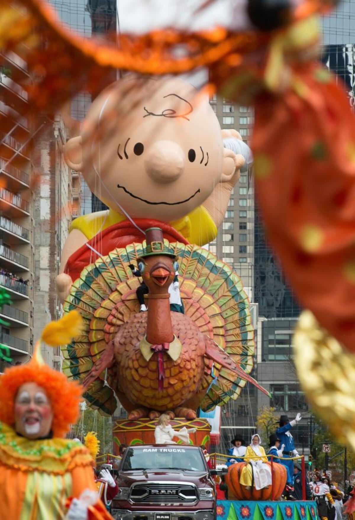 The Turkey float and Charlie Brown balloon move across Central Park South during last year’s Macy’s Thanksgiving Day Parade. This year’s version will air live from New York on Thanksgiving morning.