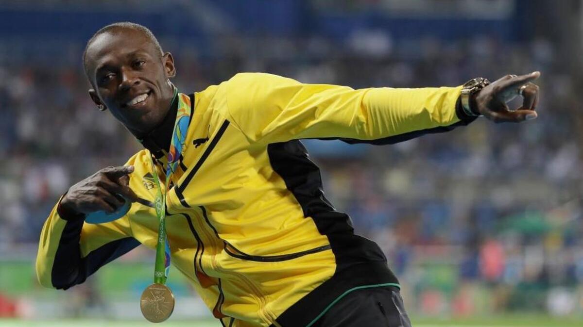 Jamaica's Usain Bolt celebrates with the gold medal after winning the men's 100-meter final during the athletics competitions of the 2016 Summer Olympics at the Olympic stadium in Rio de Janeiro, Brazil, Monday, Aug. 15, 2016.